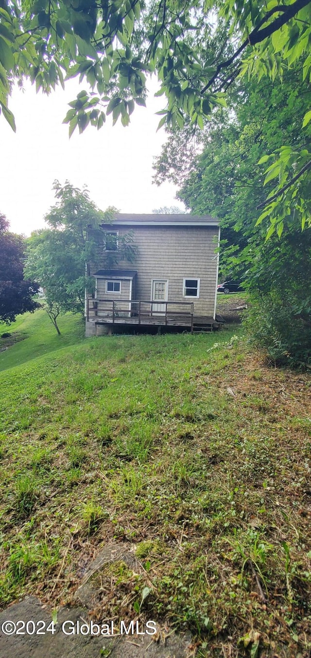 back of house with a yard