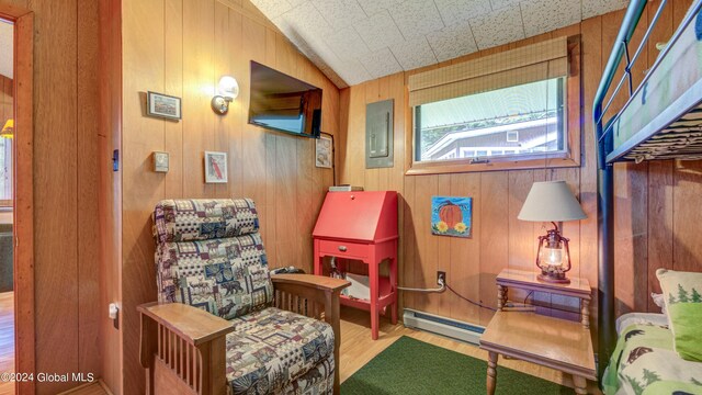 2769 State Route 8 # 2, Speculator, NY 12164 - sitting room with a baseboard heating unit, wood finished floors, wood walls, and electric panel