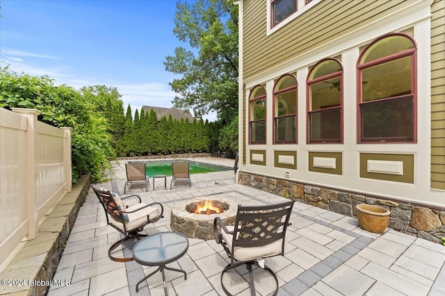 view of patio / terrace with a fire pit