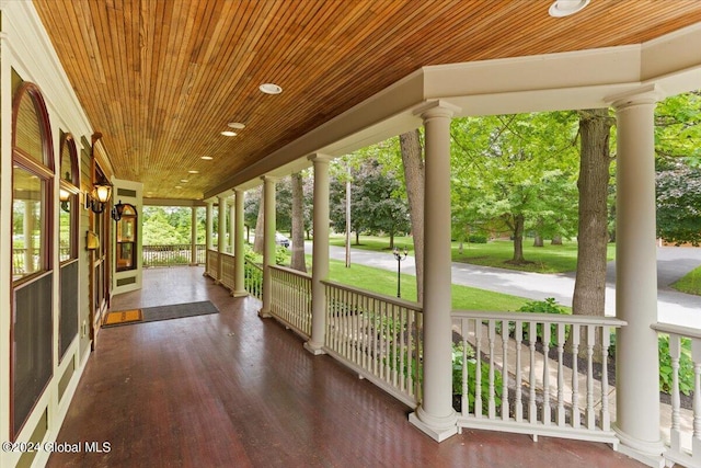 unfurnished sunroom with wooden ceiling