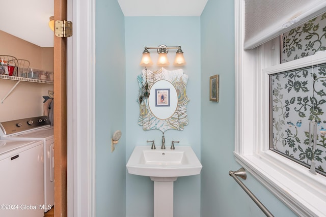 bathroom featuring washer and dryer
