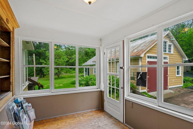 unfurnished sunroom featuring a wealth of natural light