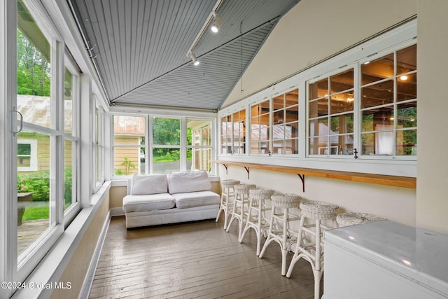 sunroom featuring track lighting