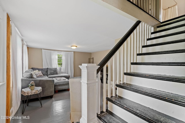 staircase with hardwood / wood-style flooring