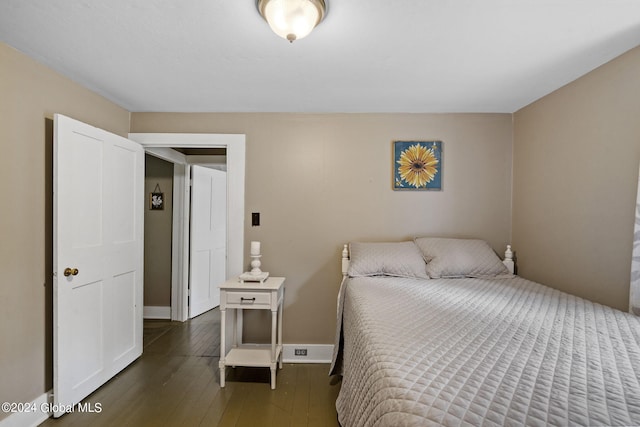 bedroom featuring dark wood-type flooring