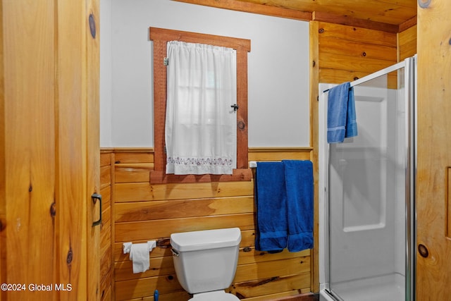 bathroom with an enclosed shower and toilet