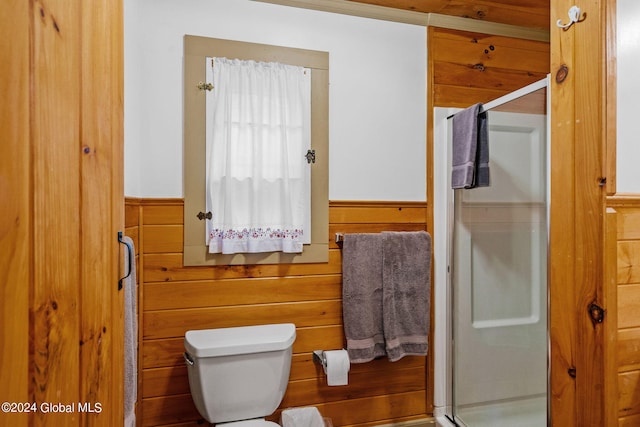 bathroom featuring walk in shower and toilet