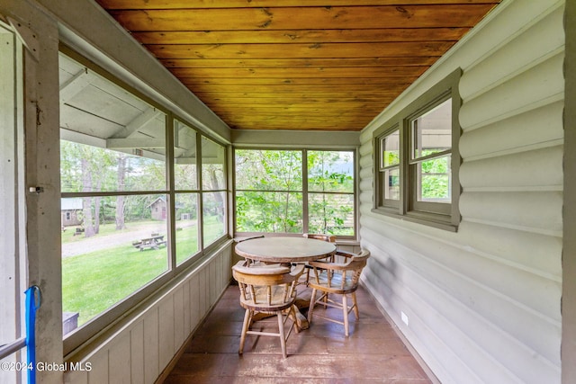 sunroom featuring wooden ceiling