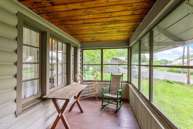 sunroom / solarium featuring wood ceiling