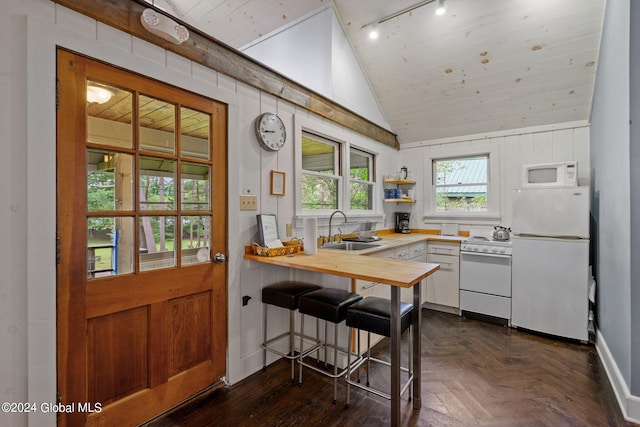 kitchen with white appliances, dark parquet flooring, sink, lofted ceiling, and wooden ceiling