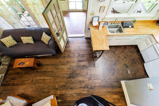 interior space with sink and dark hardwood / wood-style flooring