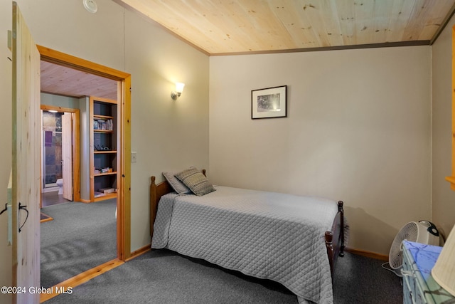 carpeted bedroom with vaulted ceiling and wood ceiling