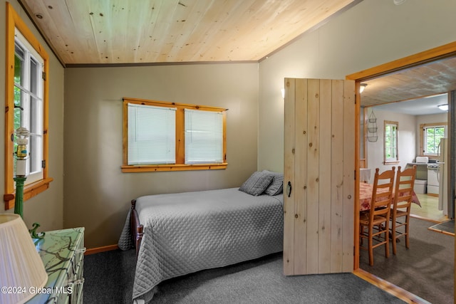 bedroom with lofted ceiling, carpet flooring, and wooden ceiling