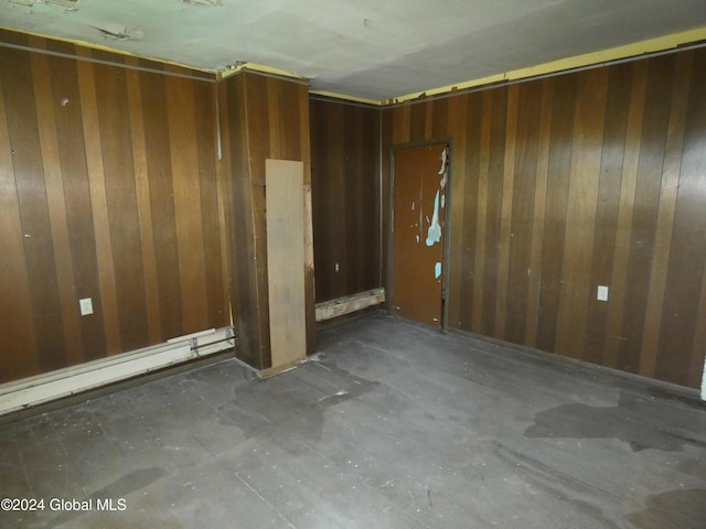 empty room with wood walls