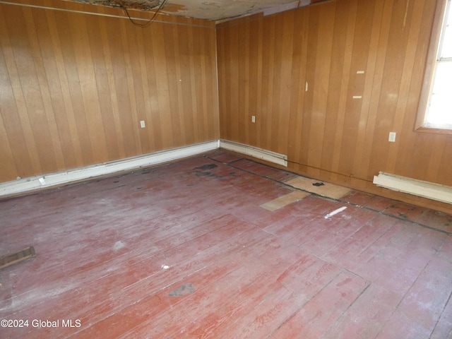 unfurnished room with hardwood / wood-style floors