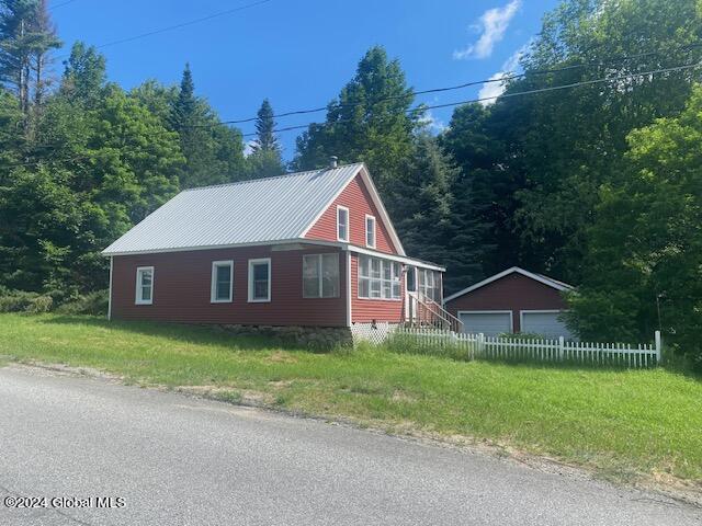 302 Edwards Hill Rd, Johnsburg, NY 12811 - view of side of home featuring an outdoor structure and a garage