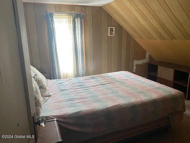 302 Edwards Hill Rd, Johnsburg, NY 12811 - bedroom with lofted ceiling and wooden walls