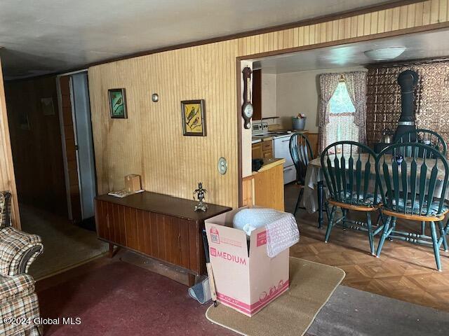 302 Edwards Hill Rd, Johnsburg, NY 12811 - interior space featuring dark parquet flooring and wood walls
