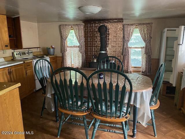 302 Edwards Hill Rd, Johnsburg, NY 12811 - dining room featuring parquet floors and washer / dryer