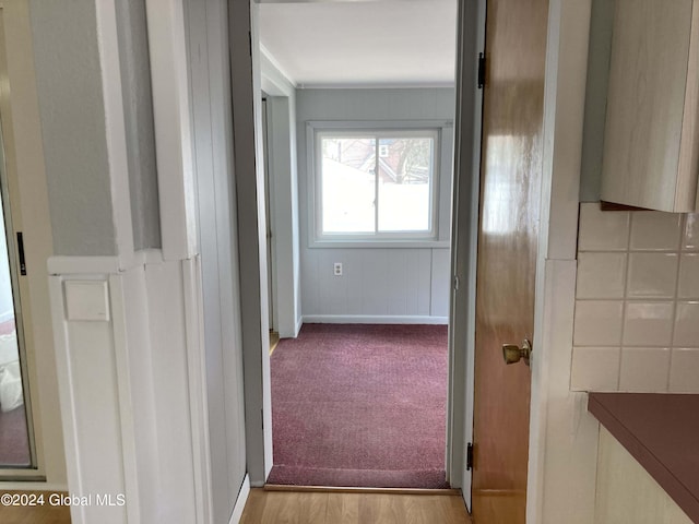 hallway with light carpet