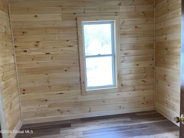 22 Lexington Ave, Gloversville, NY 12078 - unfurnished room featuring wooden walls and dark wood finished floors