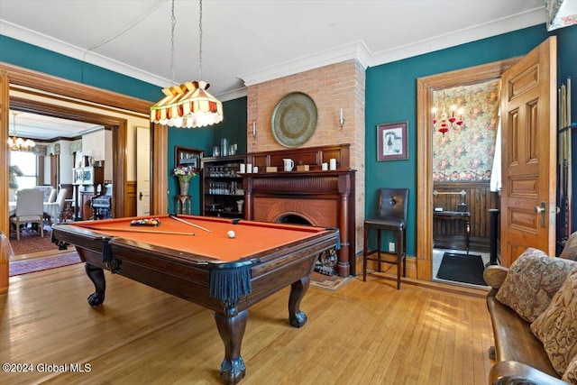 playroom featuring brick wall, ornamental molding, hardwood / wood-style floors, and billiards