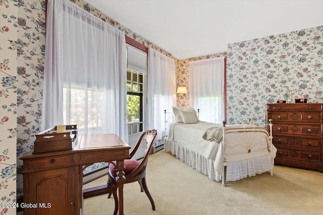 bedroom with carpet and baseboard heating