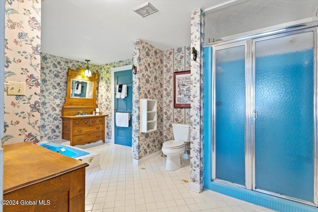 bathroom featuring walk in shower, tile patterned floors, toilet, and vanity