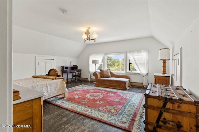 bedroom with dark wood-type flooring, vaulted ceiling, and a chandelier