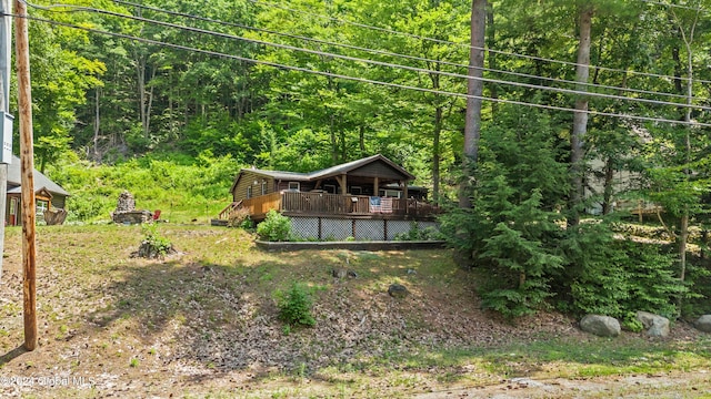 view of yard featuring a wooden deck