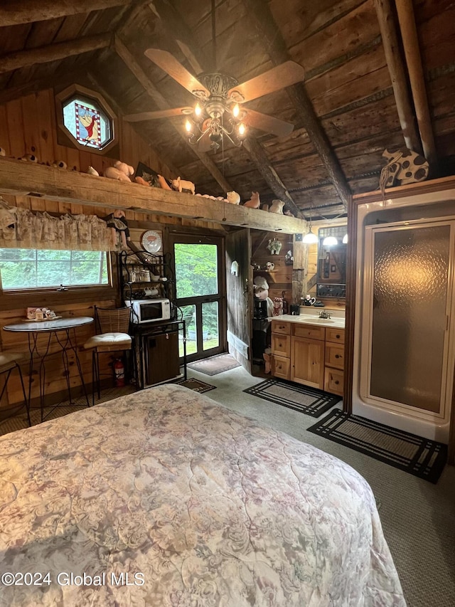 bedroom with lofted ceiling with beams, sink, wood ceiling, and multiple windows