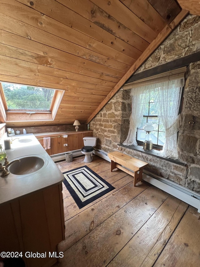 bathroom with vanity, a wealth of natural light, hardwood / wood-style floors, and wood ceiling