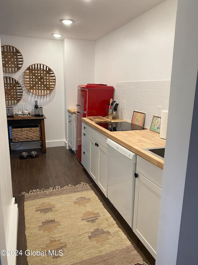 bar featuring fridge, dark wood-type flooring, white dishwasher, and backsplash