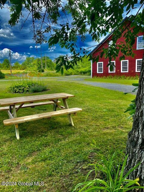 view of community featuring a lawn