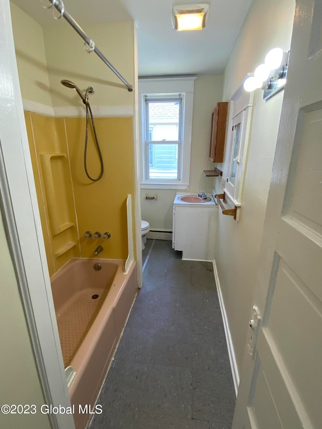 full bathroom featuring baseboard heating, toilet, tile patterned floors, sink, and tub / shower combination