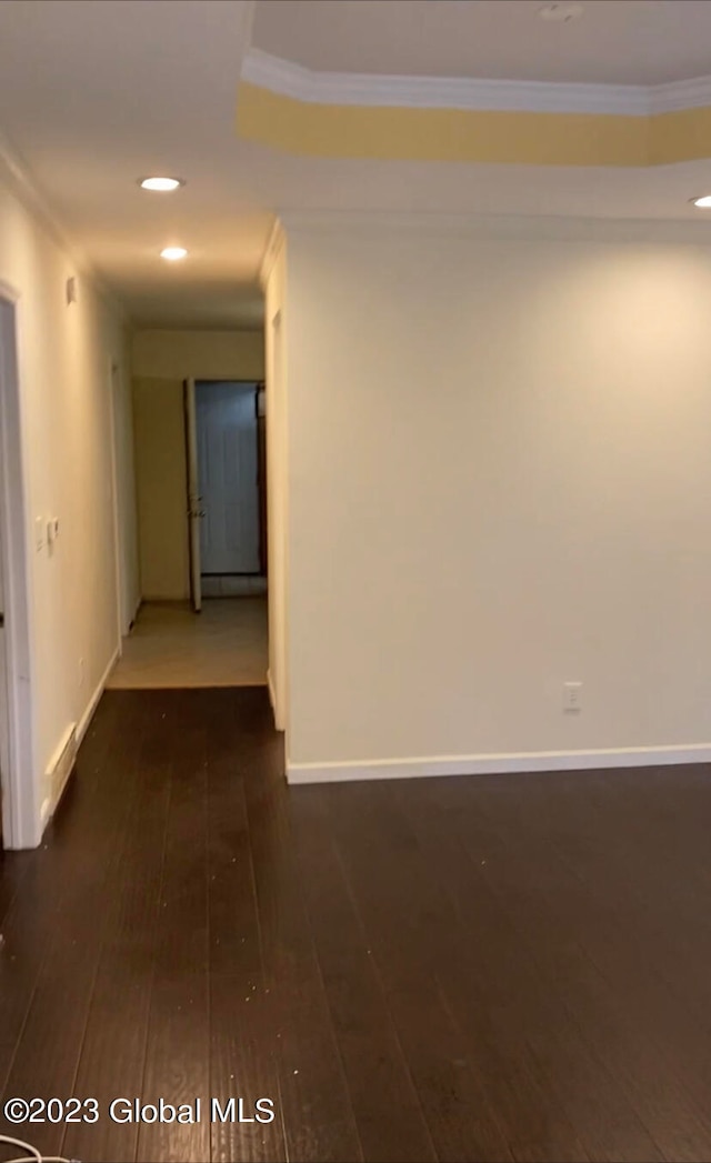 spare room with ornamental molding and hardwood / wood-style flooring