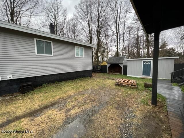 view of home's exterior featuring a shed