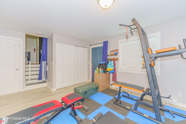 workout area featuring hardwood / wood-style flooring