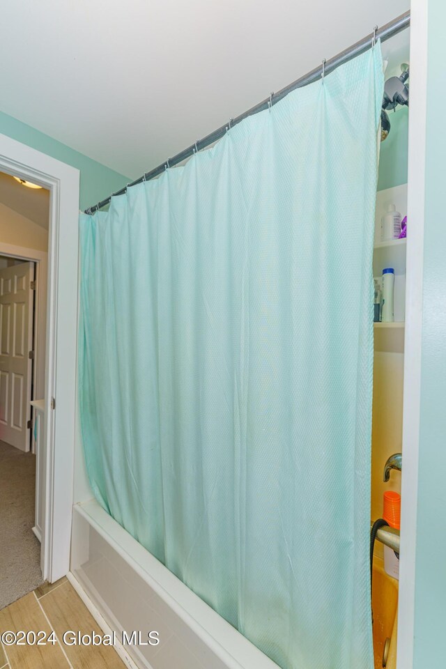 bathroom with wood-type flooring