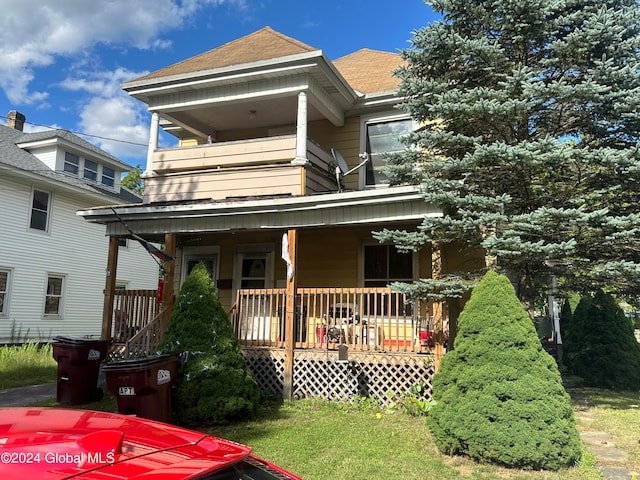 rear view of house with covered porch