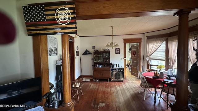 26 Alexander St, Gloversville, NY 12078 - dining room with decorative columns, hardwood / wood-style flooring, a chandelier, baseboards, and ornamental molding