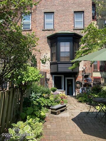 view of exterior entry featuring a patio