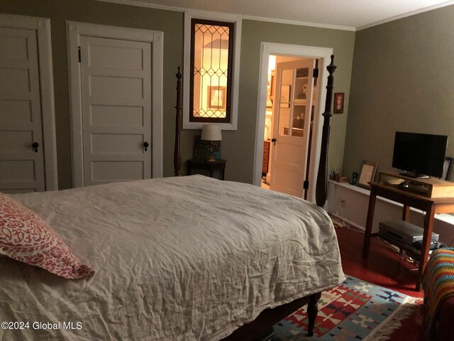 bedroom featuring ornamental molding