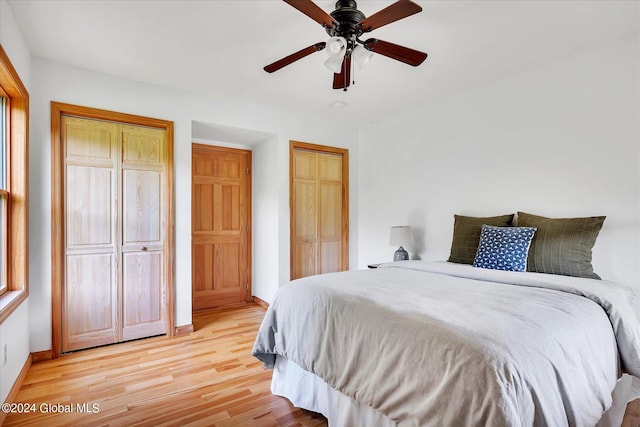 bedroom with light hardwood / wood-style flooring and ceiling fan