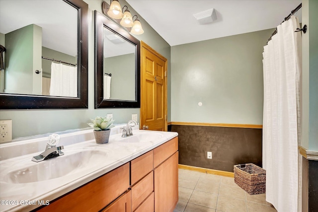 bathroom with tile patterned floors and vanity