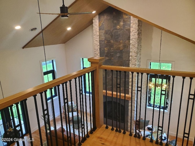 interior space with wood-type flooring and high vaulted ceiling