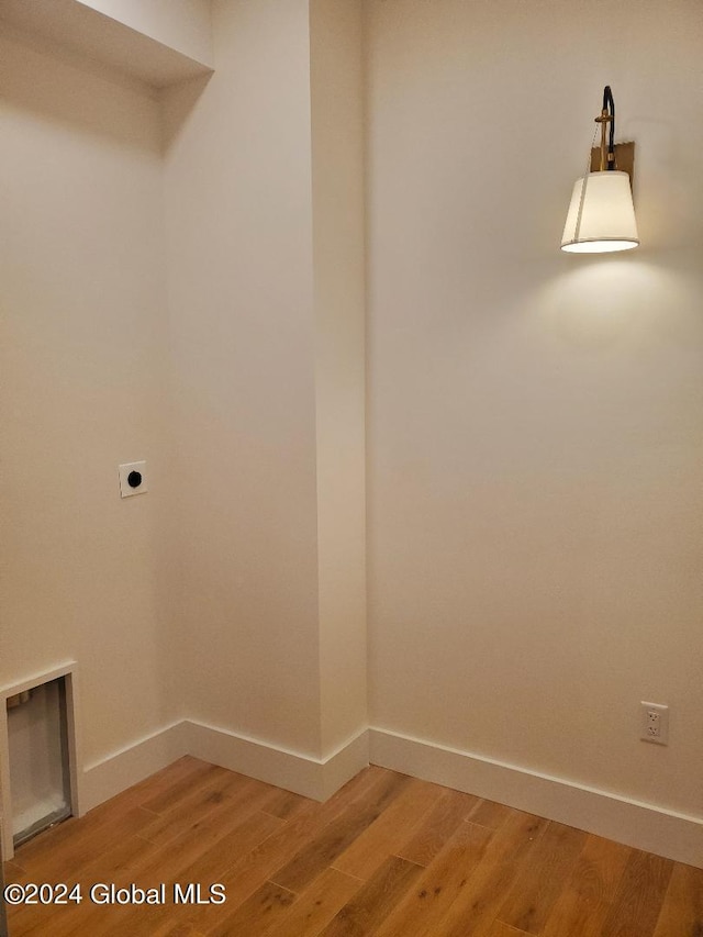 washroom featuring hookup for an electric dryer and hardwood / wood-style floors