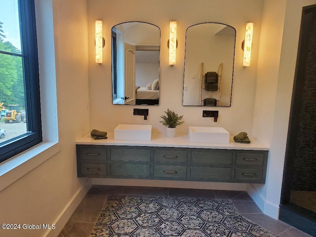 bathroom with tile patterned flooring and vanity