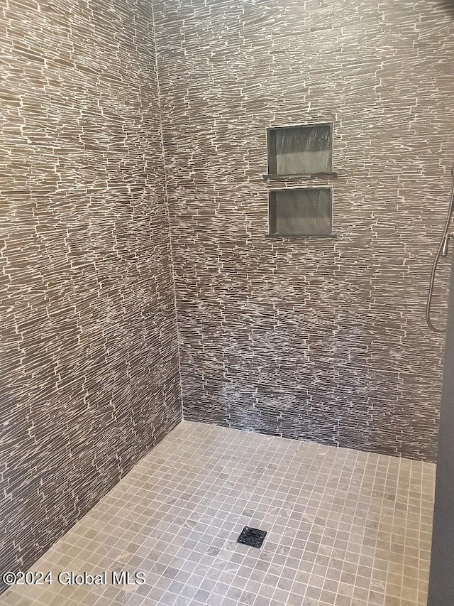 interior space with tiled shower