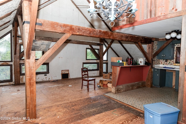 interior space featuring vaulted ceiling and an inviting chandelier